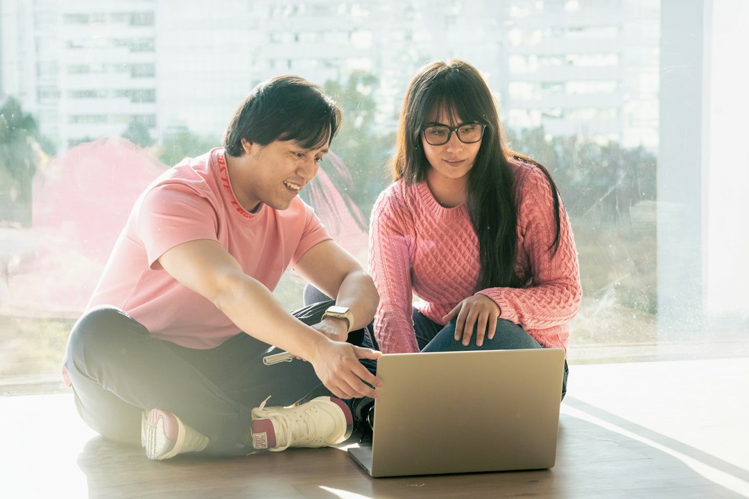 Two people sharing their plans while looking at a laptop.